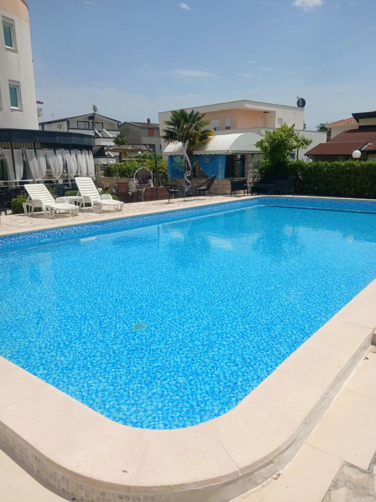Wide view along the outdoor swimming pool